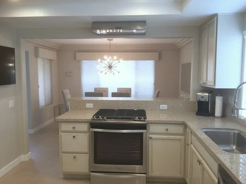 Renovated Palm Springs kitchen with an opening to the dining room