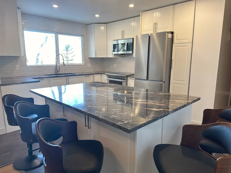 Kitchen island seating and stainless refrigerator in Dalhousie