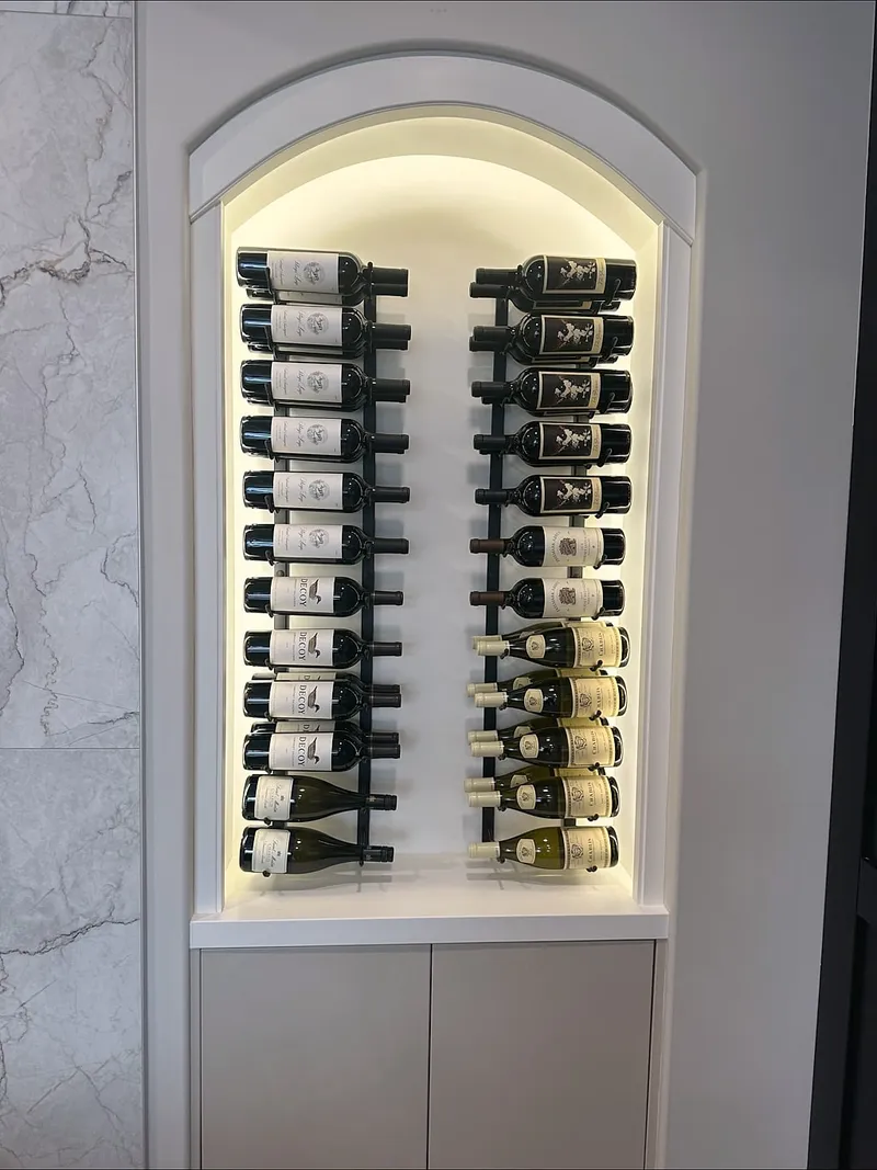 Completed illuminated wine storage in an arched Wentworth niche