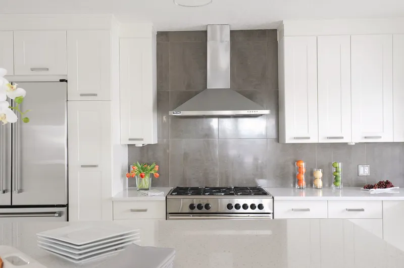 White kitchen cabinetry and stainless range hood in Upper Scarboro