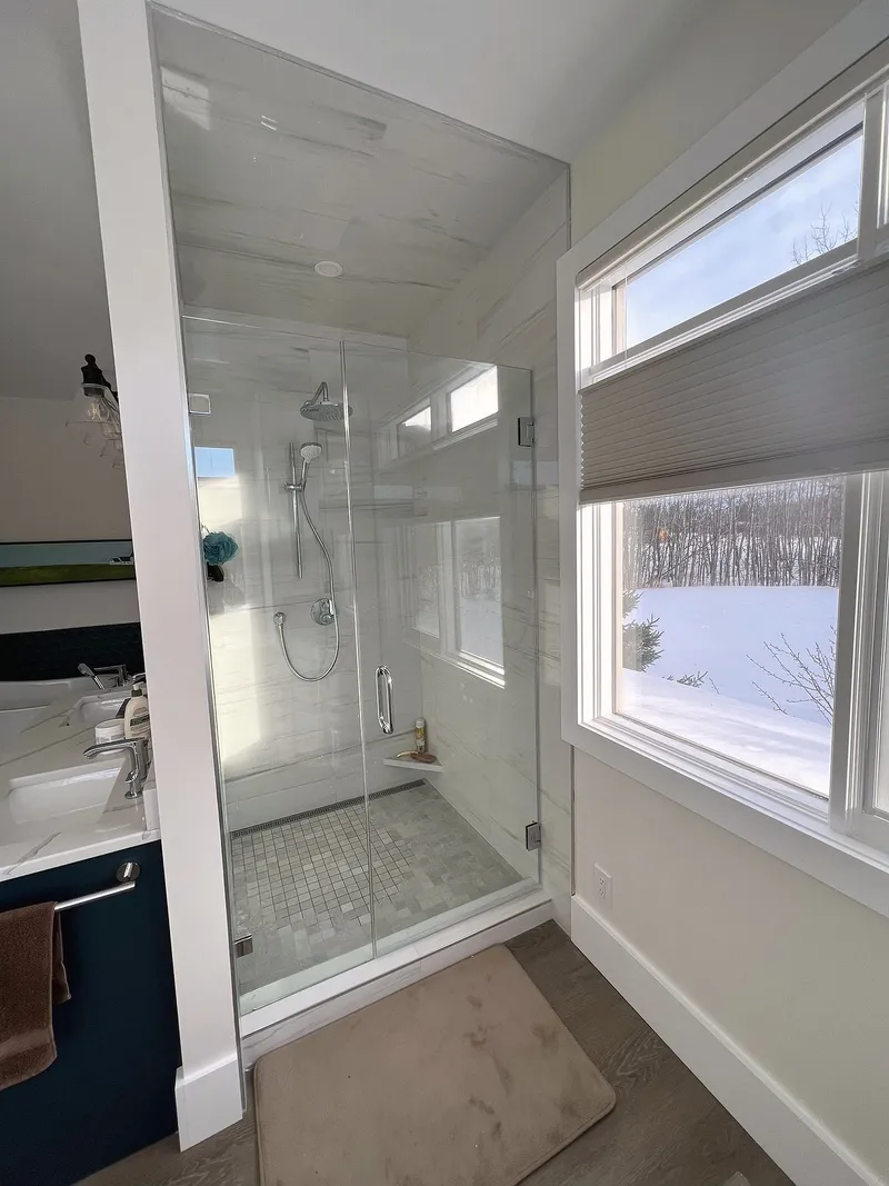 Glass shower beside the ensuite window in Bearspaw