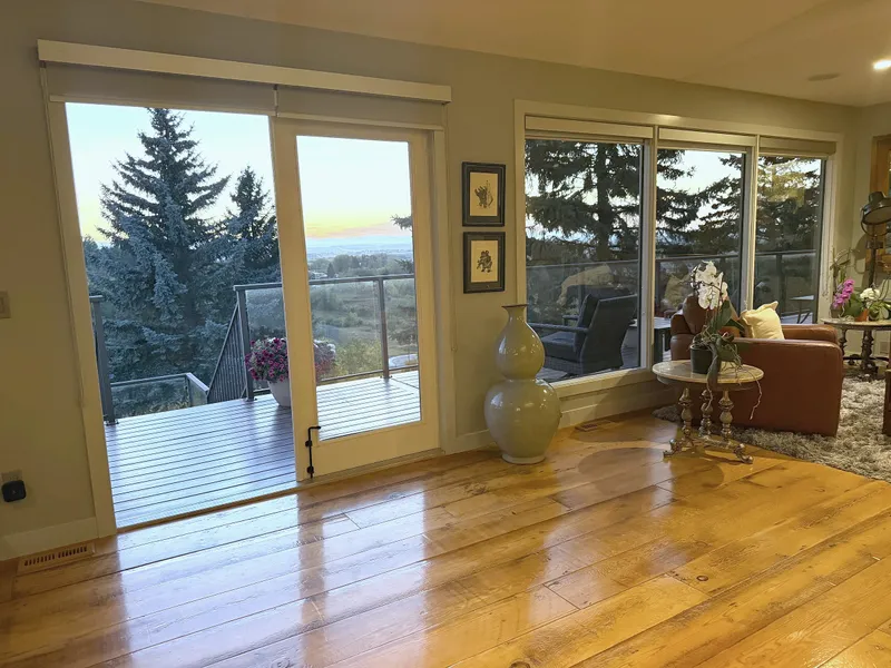 Artists View living room with wood flooring and wide garden-facing windows