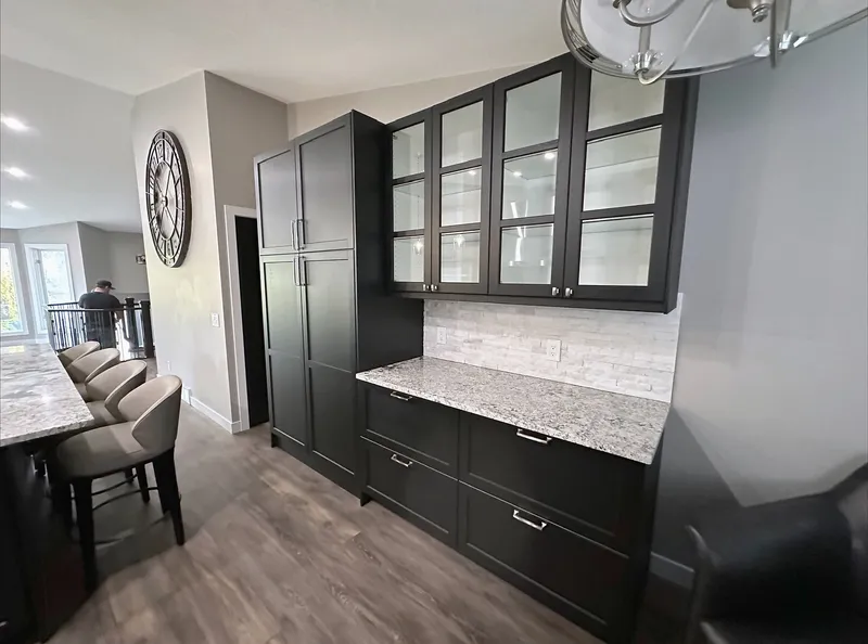 Glass-front display cabinets and stone worktop in Harvest Hills