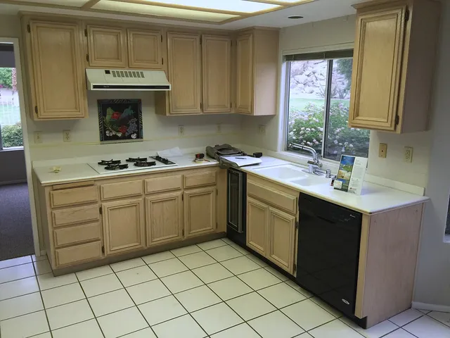 Original Palm Springs kitchen with wood cabinets and tiled floor