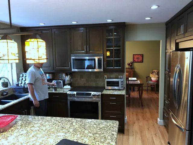 Original dark wood Edgemont kitchen cabinets and raised counter