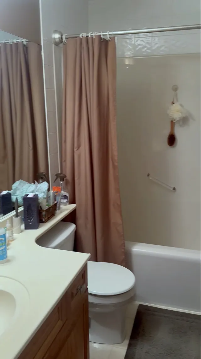 Original Signal Hill bathroom with short vanity and shower curtain