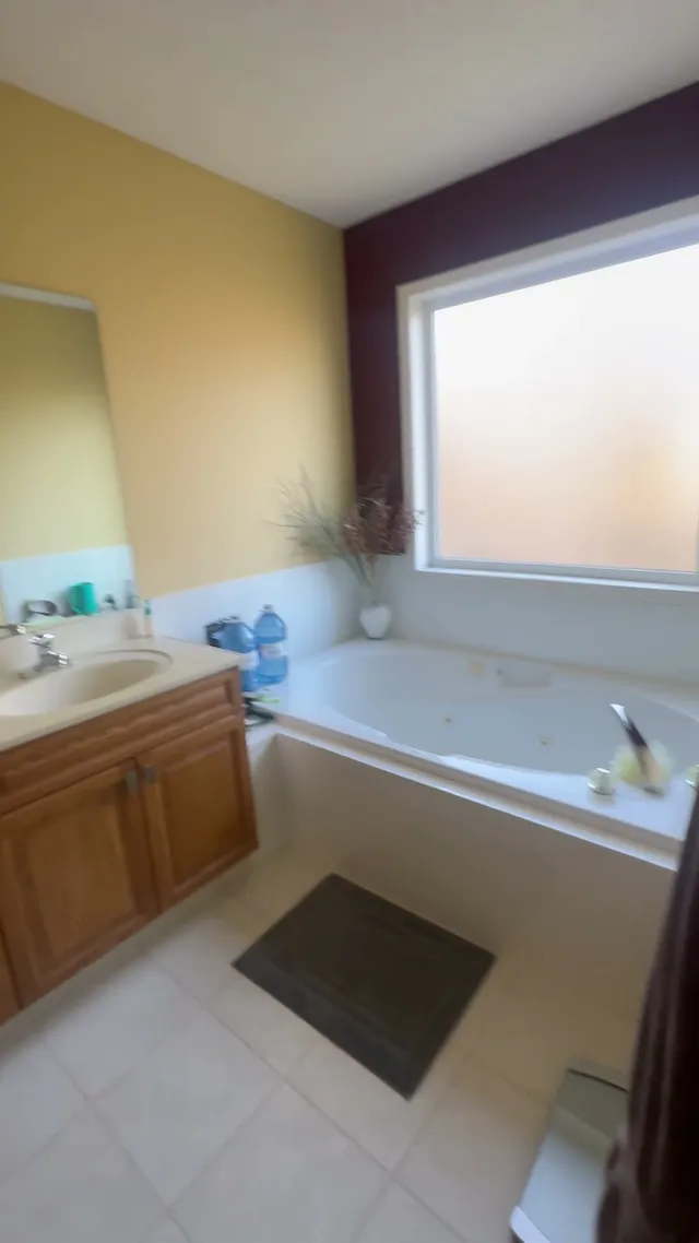 Original Aspen ensuite with a built-in tub and tiled surround