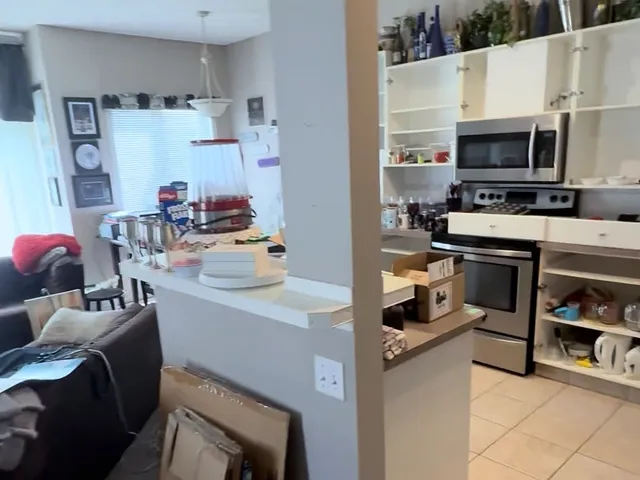 Original peninsula separating the condo kitchen from the living area