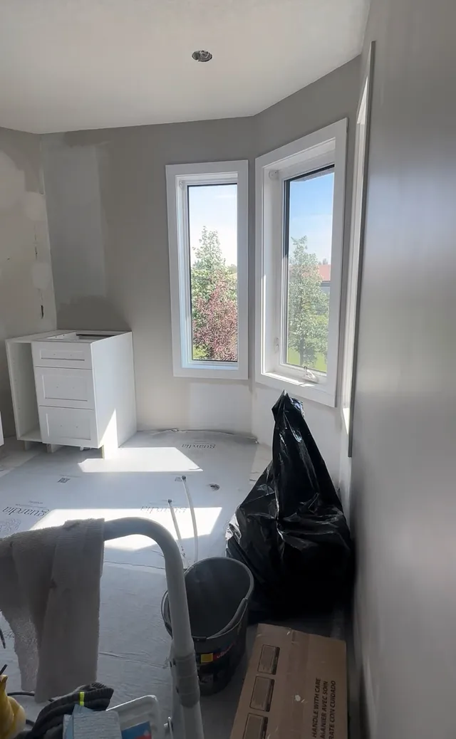 Original bathtub beneath the McKenzie Towne ensuite windows