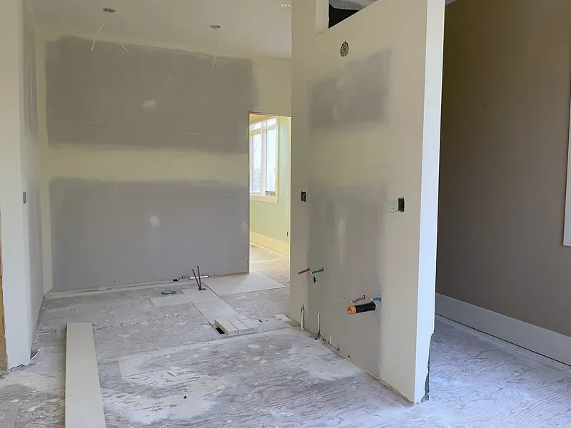 Bearspaw ensuite during drywall and floor preparation
