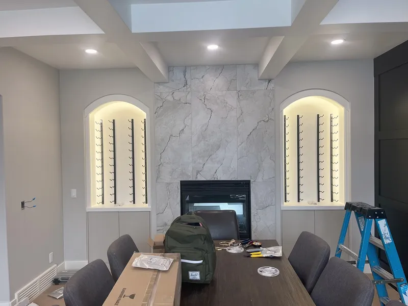Wentworth dining-room fireplace and wine niches during final finishing