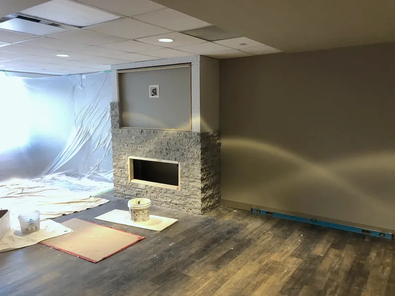 Stone fireplace being built at Silver Springs Country Club
