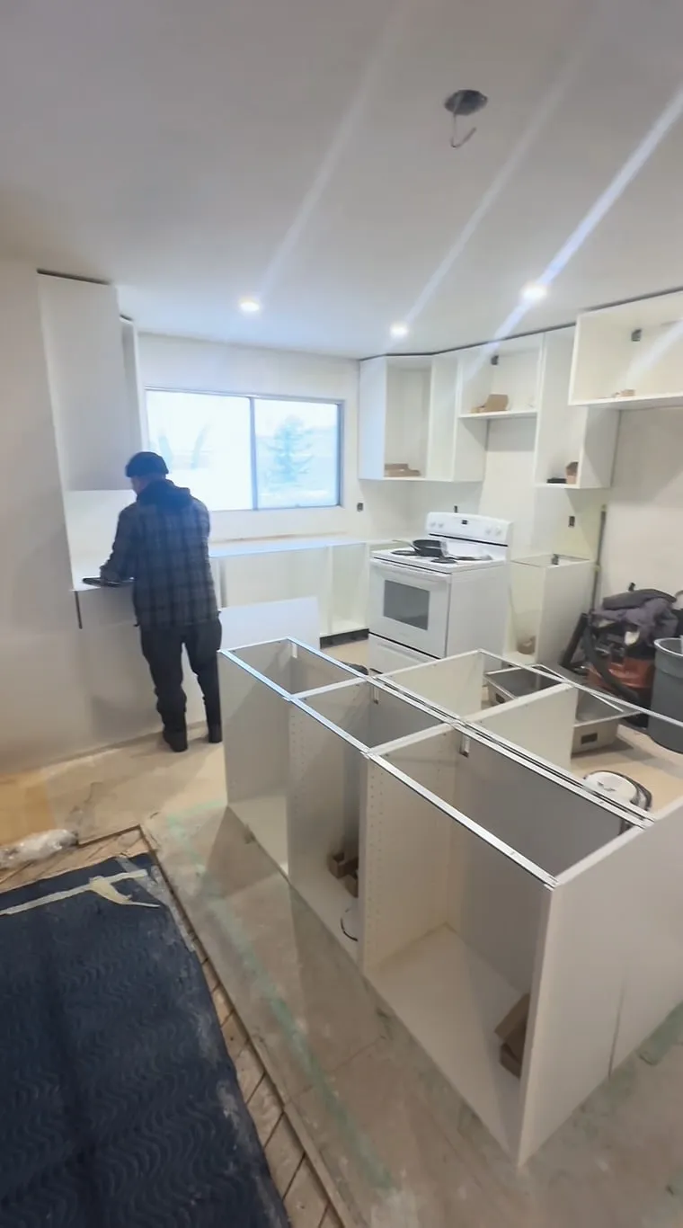 Cabinet bases being fitted in the Dalhousie kitchen