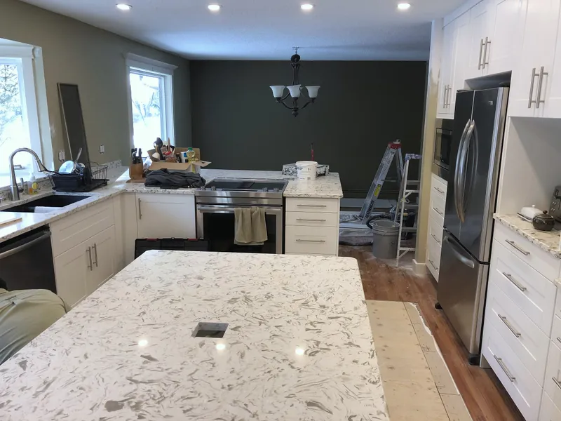 Edgemont kitchen during final cabinet and lighting work